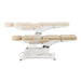 Pavo 4-Motors Swivel Medical Spa Treatment Table Beige Variant Side View And Fully Reclined Demonstrating An Up And Down Adjustment On White Background