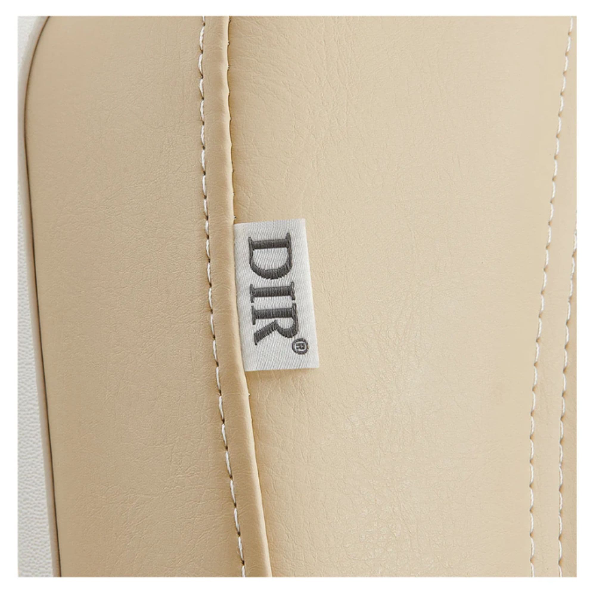 Pavo 4-Motors Swivel Medical Spa Treatment Table Close-Up View Of Beige Upholstery With Brand Name