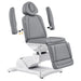 Pavo Quad-Motor Swivel Medical Spa Table Gray Variant Front Angled View Showing Detachable Armrest On White Background