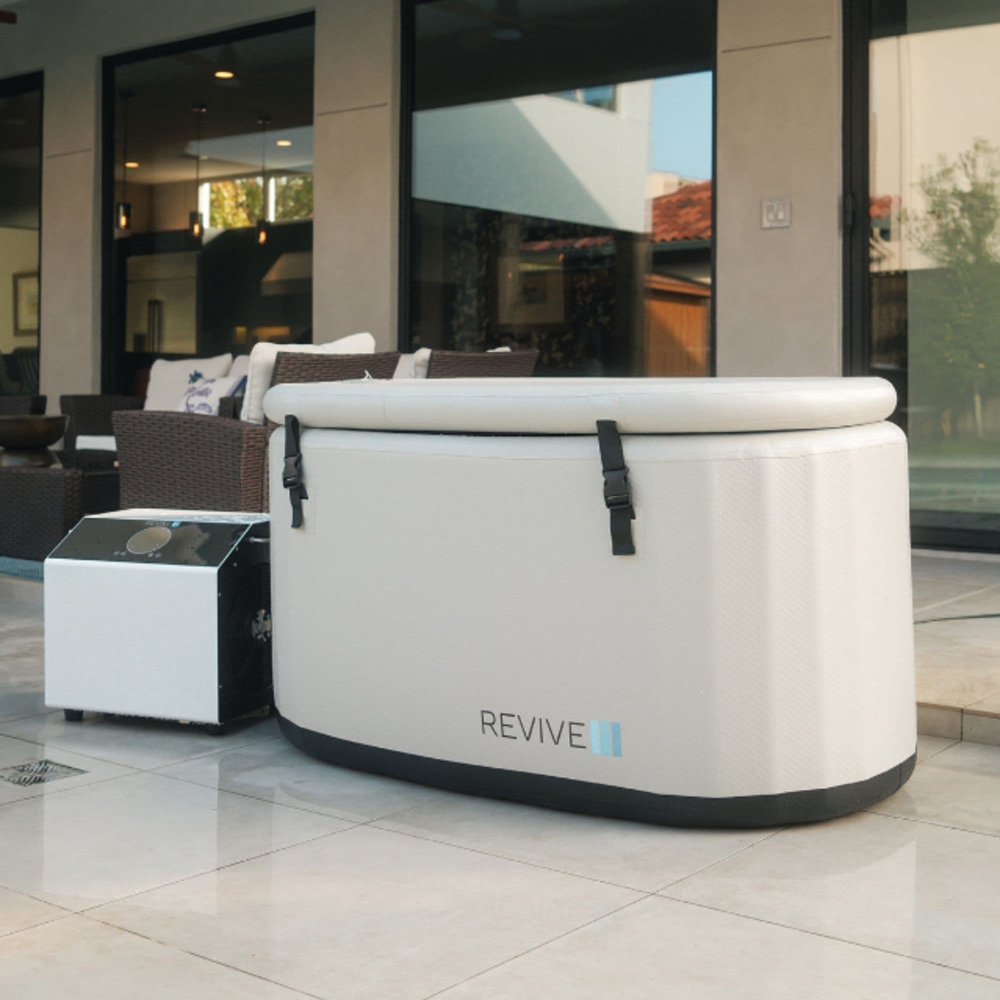 Revive Inflatable Cold Plunge Tub Angle View Of Complete Set Covered With Large Windows In Modern Living Room
