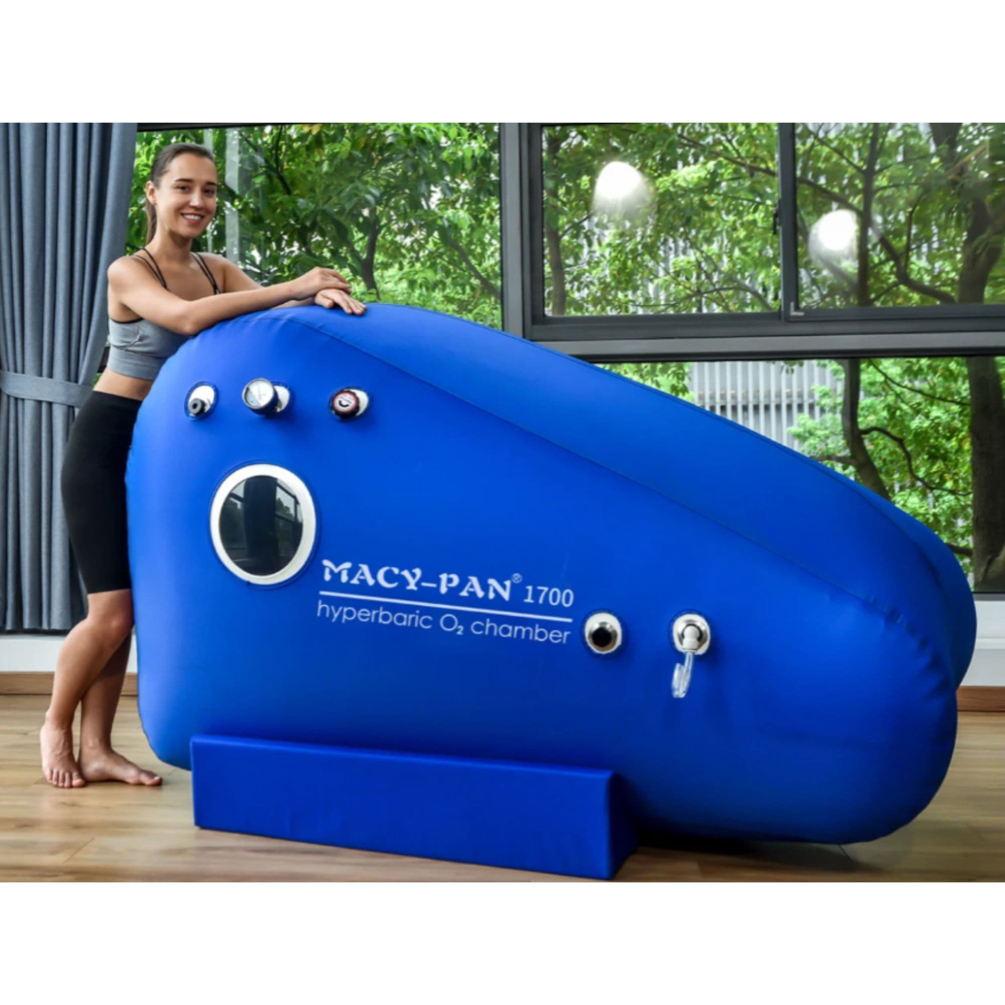 ST1700 Soft Seated Hyperbaric Chamber With A Girl Standing By Large Windows In Greenery View