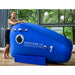 ST1700 Soft Seated Hyperbaric Chamber With A Girl Standing By Large Windows In Greenery View