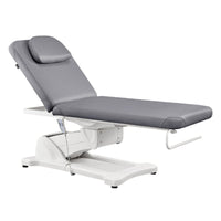 Thumbnail for Serenity Electric Treatment Table Front Angled View Of Gray Color With Remote Control On White Background