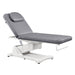 Serenity Electric Treatment Table Front Angled View Of Gray Color With Remote Control On White Background