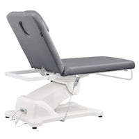 Thumbnail for Serenity Electric Treatment Table Rear View Of Gray Color And Reclined On Head Section With Remote Control On White Background