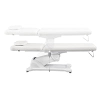 Thumbnail for Serenity Electric Treatment Table Side View And Fully Reclined Of White Color Showing An Up And Down Adjustment With Remote Control On White Background