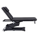 Serenity Electric Treatment Table Side View Of Black Color With Remote Control On White Background