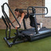SledMill With A Woman Performing A Forward Sled Push