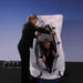 Summit to Sea Dive Vertical 40-Inch Seated Hyperbaric Chamber With Woman Assisting Another Woman Exiting
