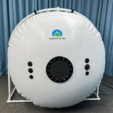 Summit to Sea Grand Dive Pro Plus Short Chamber Front View With Blue Curtain In The Background And Gray Carpet Floor