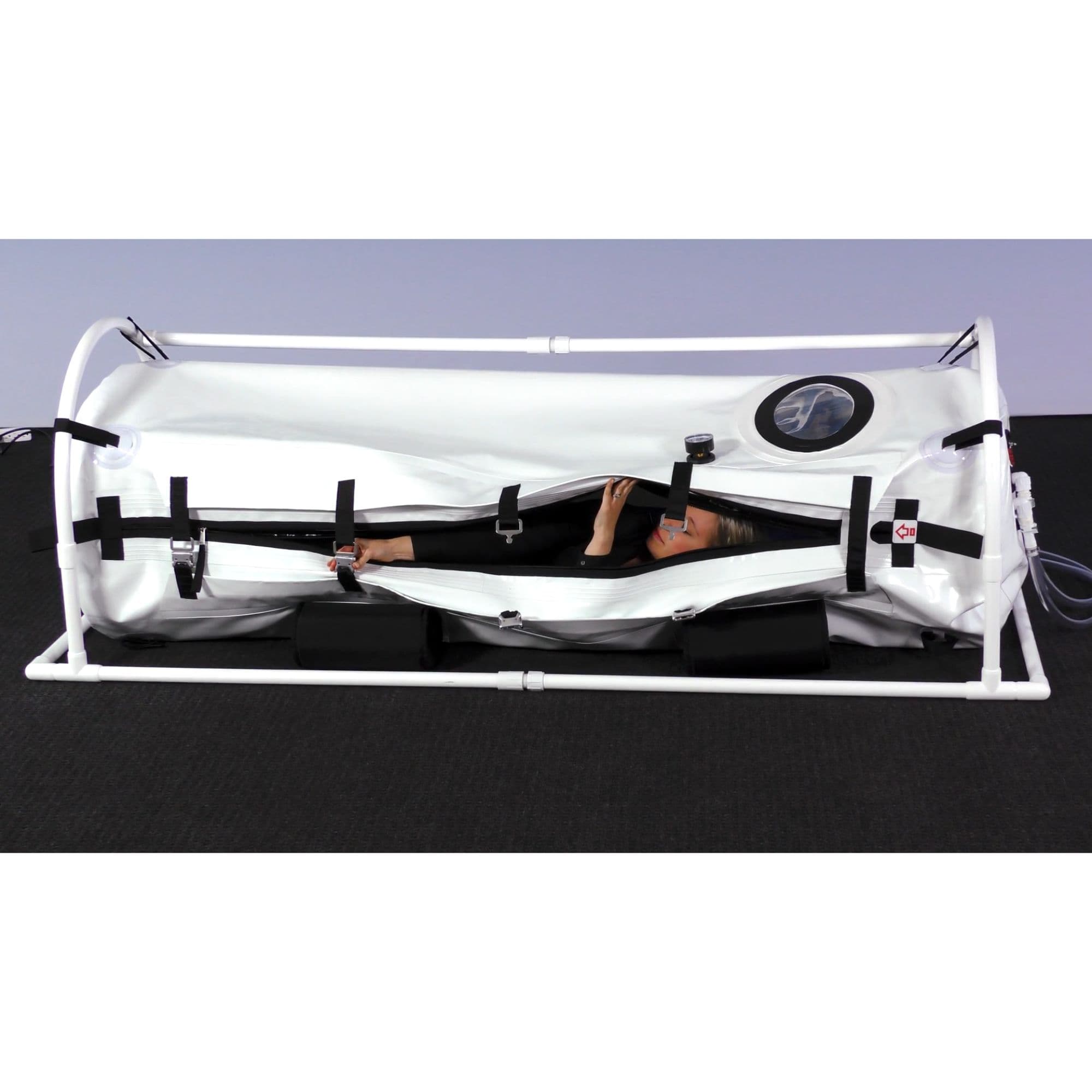 Summit to Sea Shallow Dive Hyperbaric Chamber – 26-Inch With Woman Lying Inside