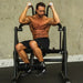 The Abs Company 6-Piece Training Equipment Package Front View Of Vertical Crunch ABS1004B With A Man Performing A Crunch Workout On Gym Setting