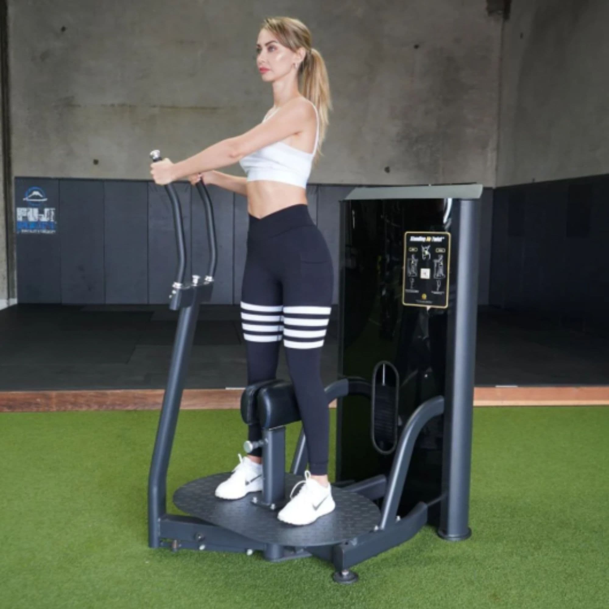 The Abs Company ABS1016 Standing Ab Twist Machine With A Woman Performing A Standing Core Exercise And Both Hands To The Right