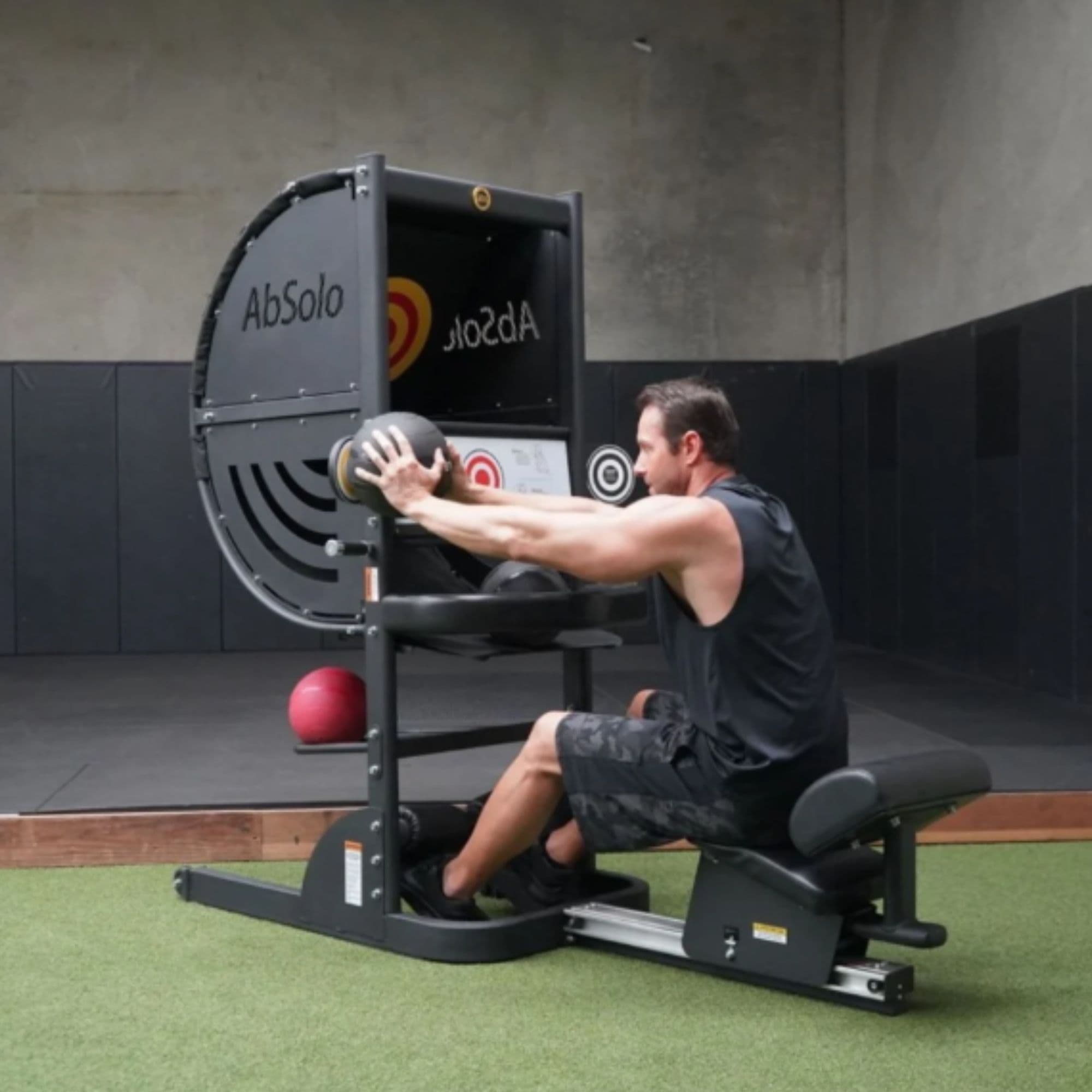 The Abs Company AbSolo – ABS1008-03B With A Man Performing A Medicine Ball Exercise