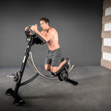 The Abs Company Ab Coaster CS3000 Front Angle View Of A Man Performing A Kneeling Core Training On A Gym Setting