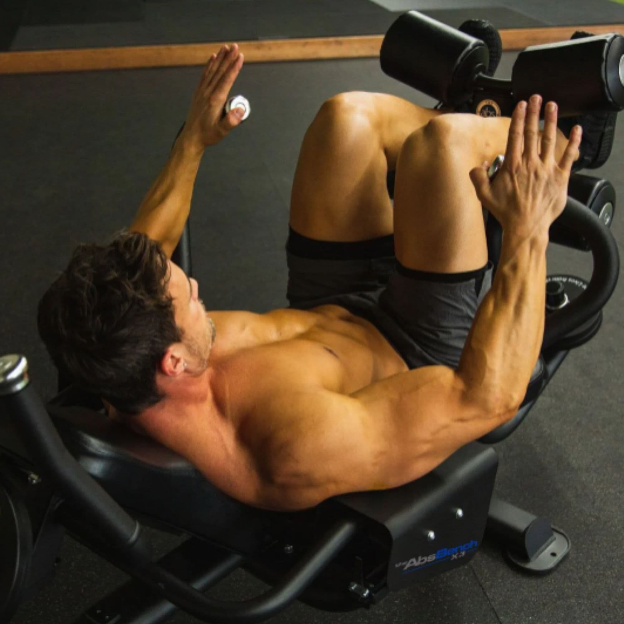 The Abs Company Abs Bench With A Man Performing A Core Crunch Exercise
