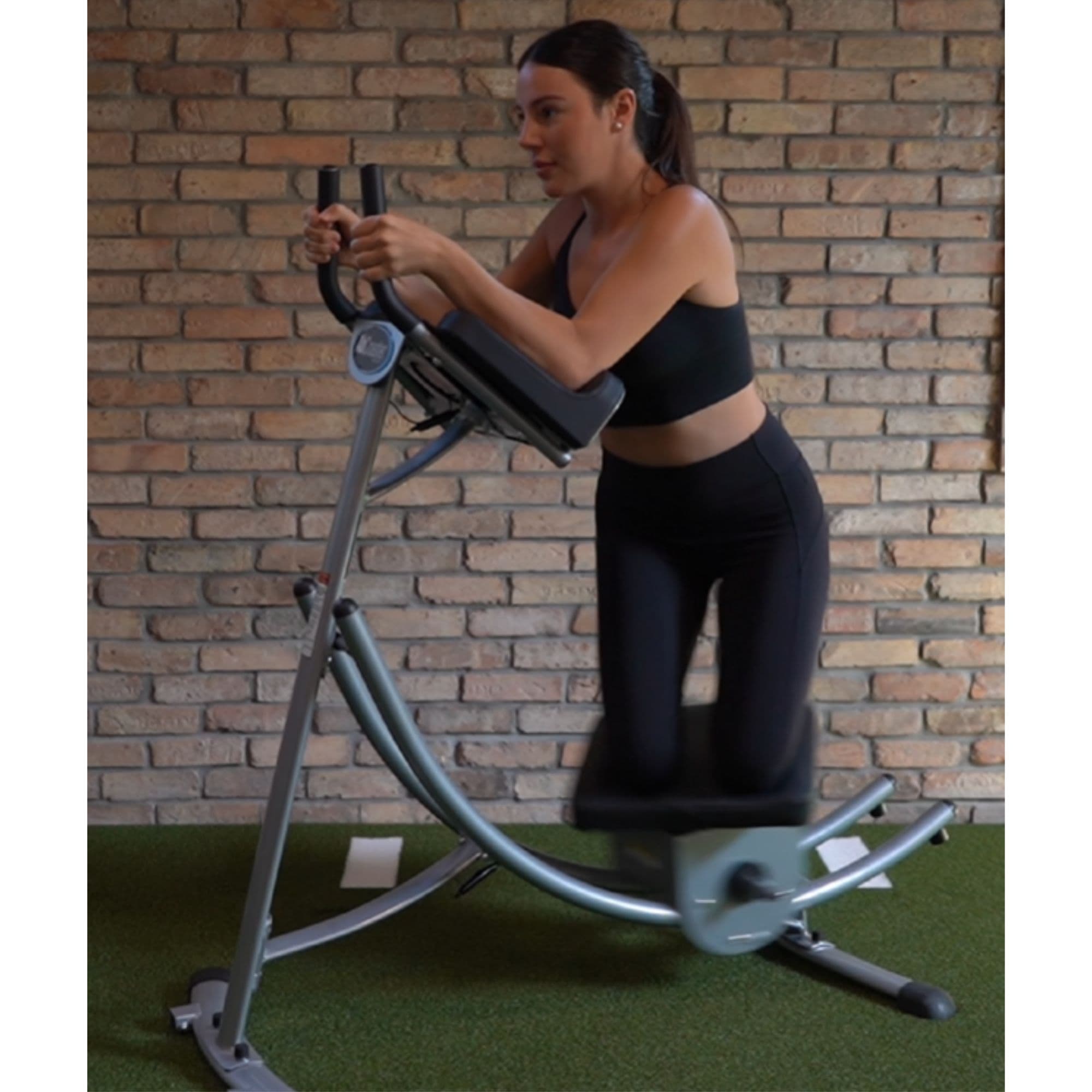 The Abs Company Max Ab Machine With A Woman Performing A Core Workout
