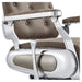 Titan Hydraulic Barber Chair Close-Up View Of Decorative Metallic Gold Armrest Support And Vintage Brown Upholstered Seat