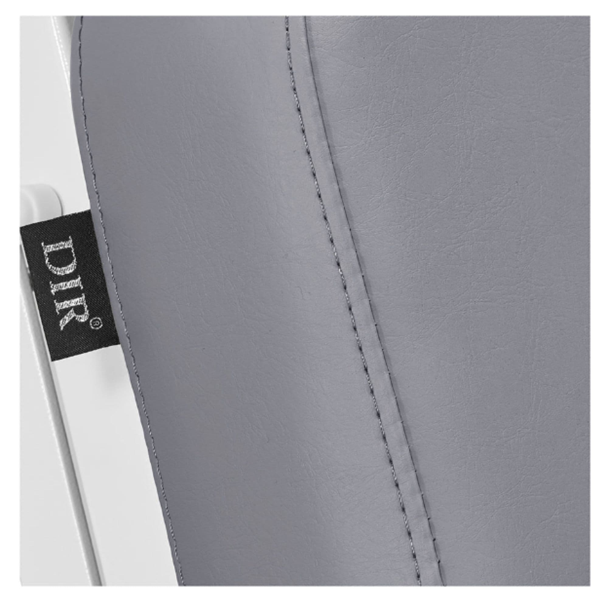 Tranquility 4-Motors Electric Medical Spa Treatment Table Close-Up View Of Gray Upholstery With Brand Name And Stitching On White Background