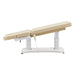 Tranquility 4-Motors Electric Medical Spa Treatment Table Side View Of Beige Variant Fully Reclined Chair With Raised Leg Section And Remote Control On White Background