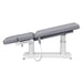 Tranquility 4-Motors Electric Medical Spa Treatment Table Side View Of Gray Variant Fully Reclined Chair With Raised Leg Section And Remote Control On White Background