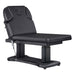 Tranquility Quad-Motor Medical Spa Treatment Table Black Variant With Remote Control On White Background