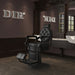 Viking Heavy Duty Classic Barber Chair Black Variant Front Angled View With Mirror A Chocolate Brown Wall And A Brand Name In The Background