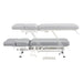 VitalEarth 2-Motors Treatment Table and Wellness Therapy Bed Gray Color Side View And Fully Reclined Showing An Up And Down Adjustment With Foot Controls On White Background