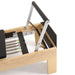 Wood Physio Reformer Close-Up View Of Foot Bar And Color Coded Springs