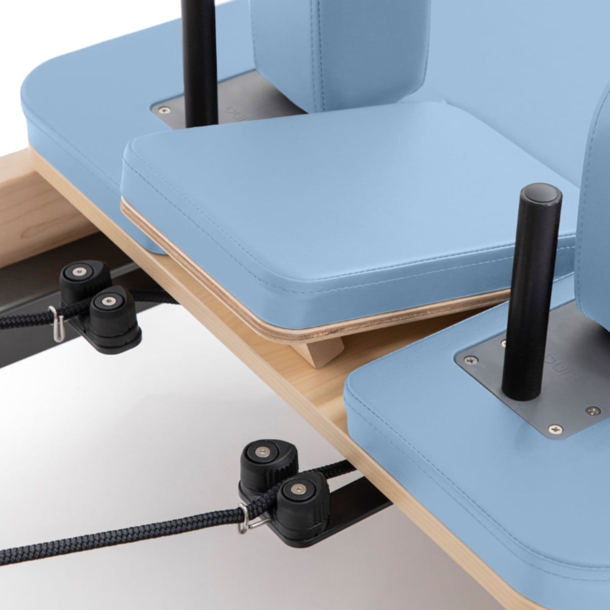 Wooden Reformer Lignum with Tower Close-Up View Of Ocean Blue Upholstery And Shoulder Rest Assembly