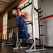 York Barbell STS Dip Attachment With A Front Angle View Of A Man Performing The Upper-Body Training On Gym Setting