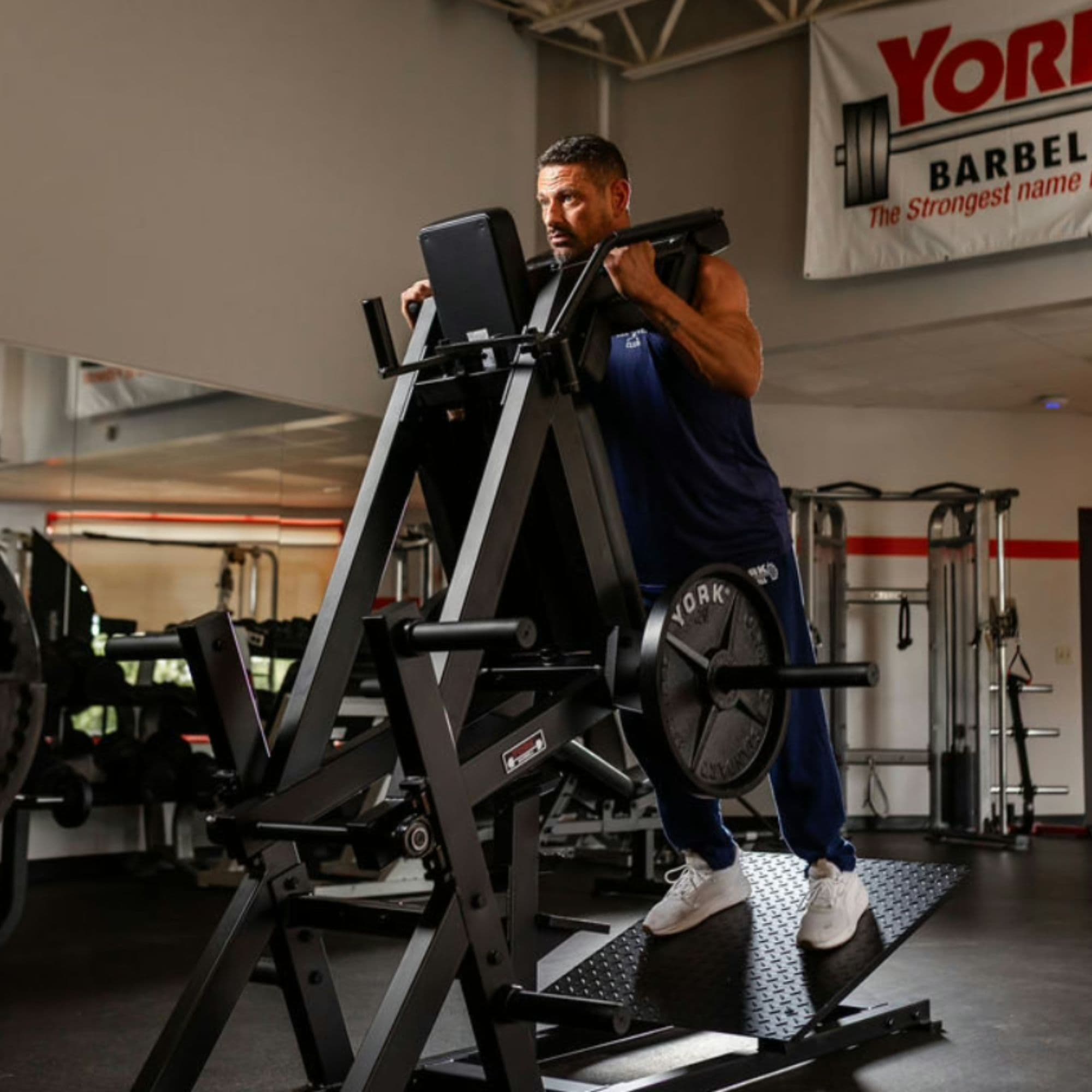 York Barbell STS Power Front Squat Front Angle View Of A Man Performing The Standing Exercise Position