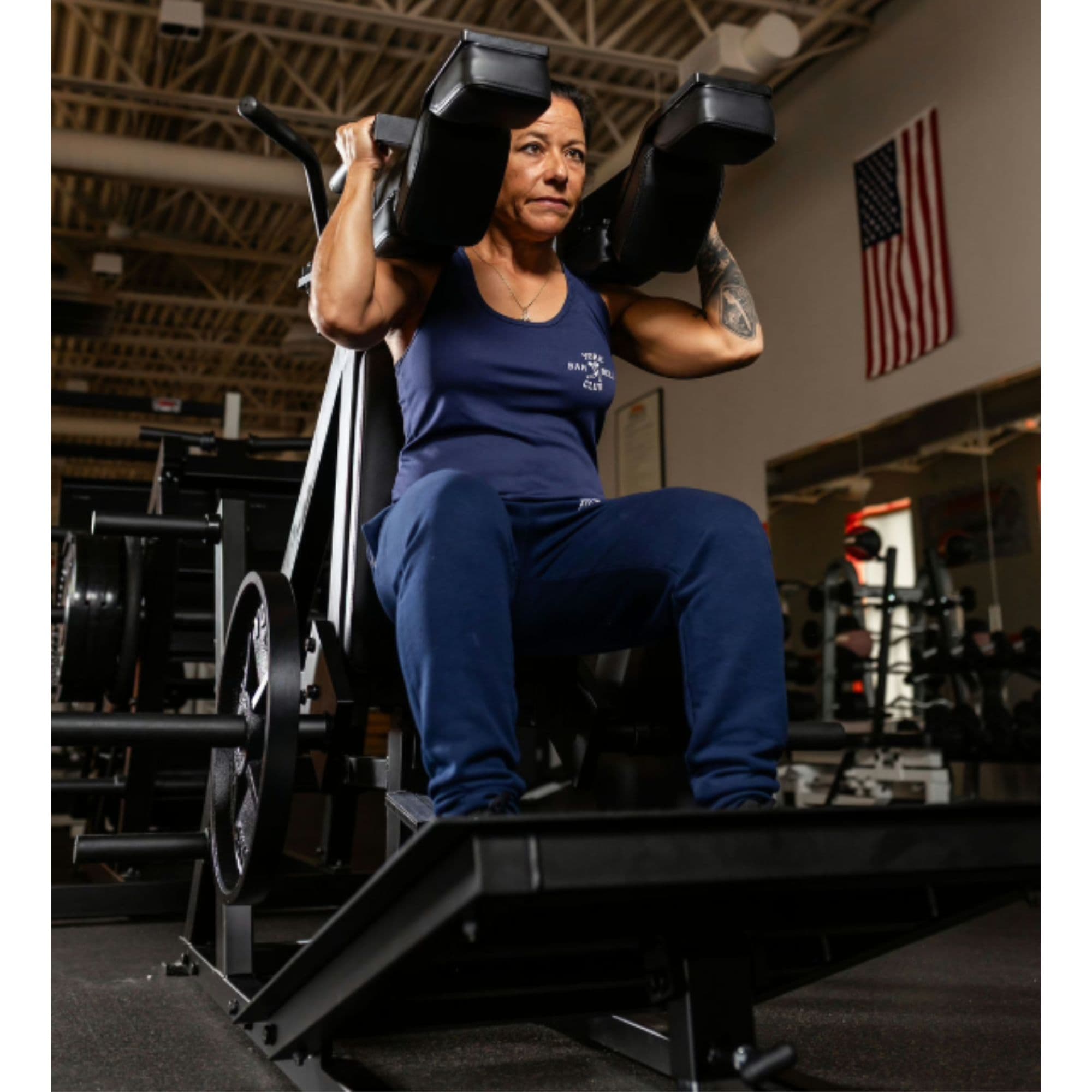 York Barbell STS Power Front Squat Front Angle View With A User Performing A Seated Exercise Position