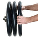 York Olympic Iso-Grip Rubber Plate Set Vertical Side View With A Hands Holding